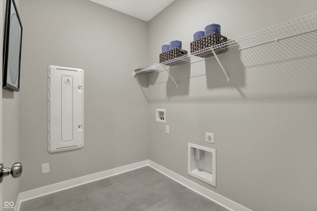 clothes washing area with hookup for an electric dryer, tile patterned flooring, and hookup for a washing machine