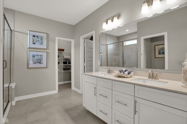 bathroom with tile patterned flooring, vanity, and an enclosed shower