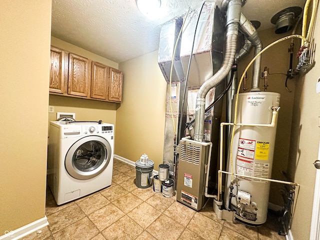 washroom featuring washer / clothes dryer, a textured ceiling, cabinets, and water heater