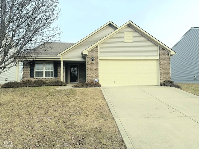 ranch-style home with a garage and a front lawn