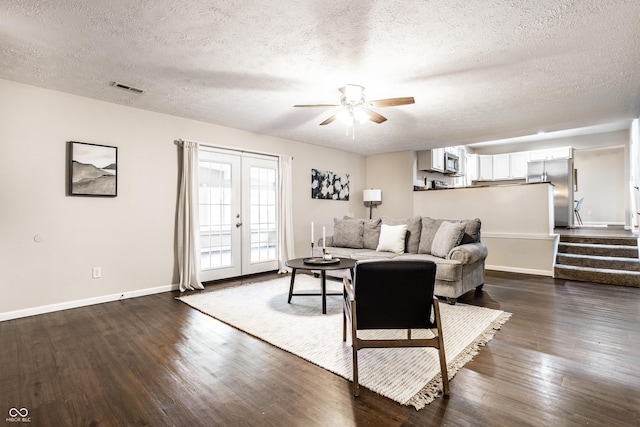 living room with visible vents, stairway, french doors, baseboards, and dark wood-style flooring