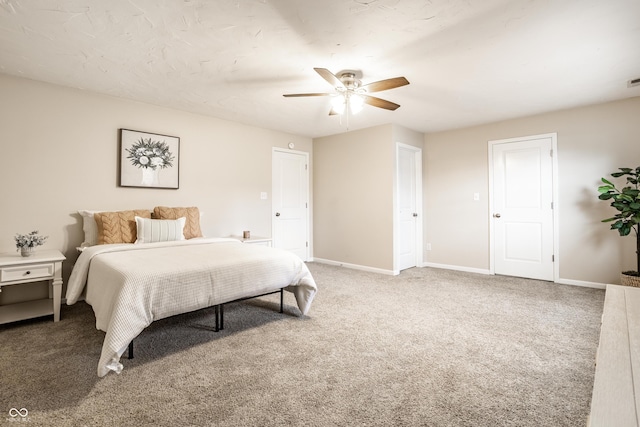 bedroom featuring a ceiling fan, baseboards, and carpet floors