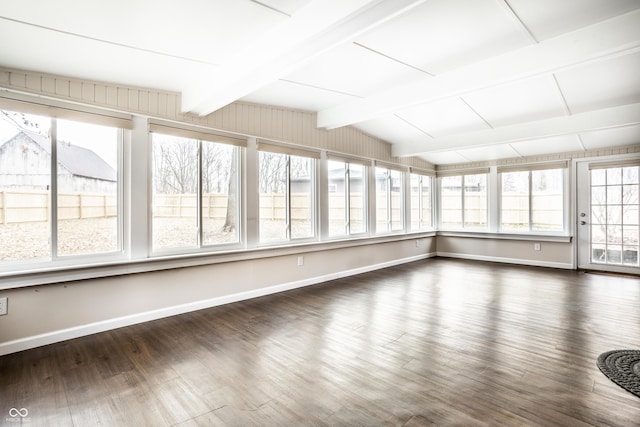 unfurnished sunroom with lofted ceiling with beams