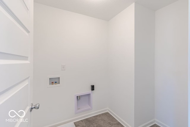 laundry area featuring tile patterned flooring and hookup for a washing machine