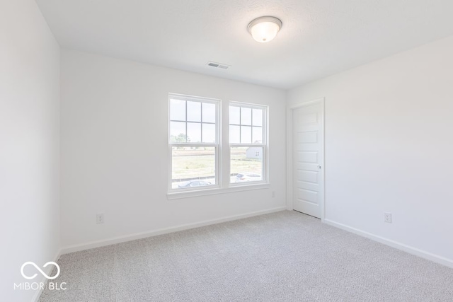 empty room featuring carpet floors