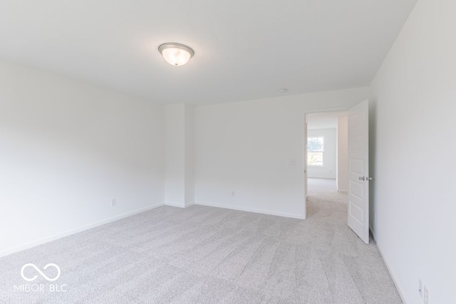 spare room with light carpet