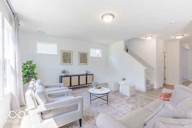 living room with light hardwood / wood-style floors