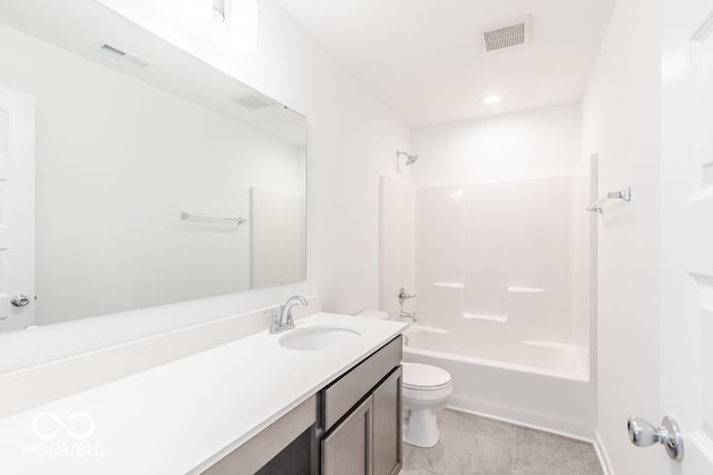 full bathroom featuring vanity, tile patterned floors, toilet, and tub / shower combination