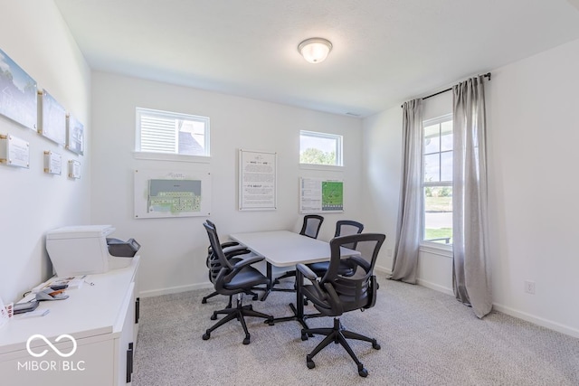 home office featuring plenty of natural light and light colored carpet