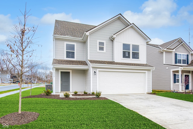 view of front of home with a garage and a front yard