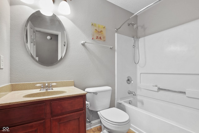 full bathroom featuring vanity,  shower combination, toilet, and a textured ceiling