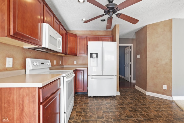 kitchen featuring a textured ceiling, ceiling fan, and white appliances