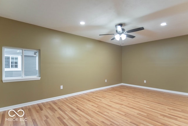 unfurnished room featuring ceiling fan and light hardwood / wood-style flooring