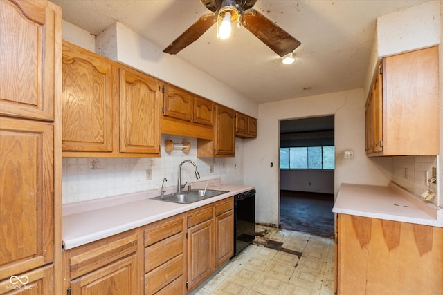 kitchen with backsplash, ceiling fan, sink, and black dishwasher