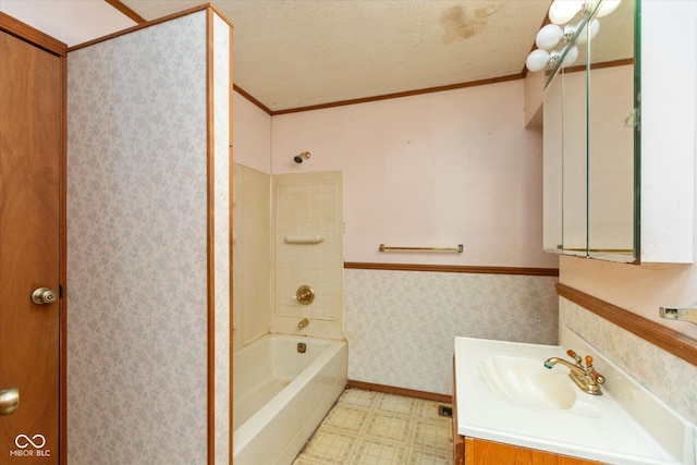 bathroom featuring crown molding, vanity, shower / bath combination, and a textured ceiling