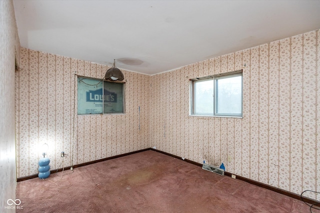 empty room featuring carpet flooring