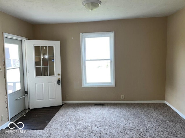 doorway with dark hardwood / wood-style flooring