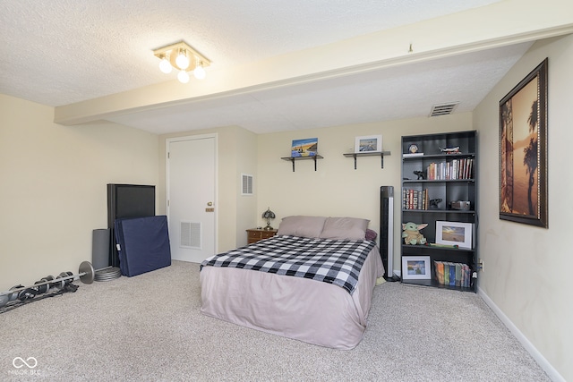 carpeted bedroom with a textured ceiling