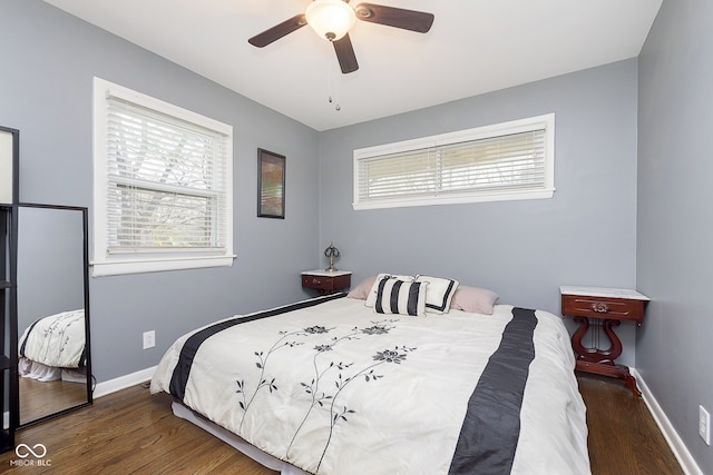 bedroom featuring ceiling fan and dark hardwood / wood-style floors