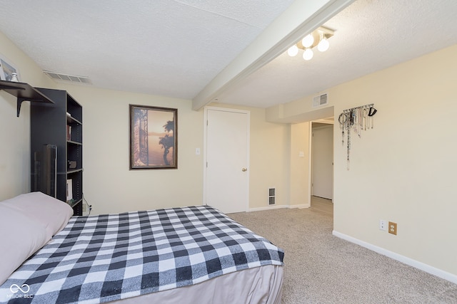 bedroom with light carpet, a textured ceiling, and beamed ceiling