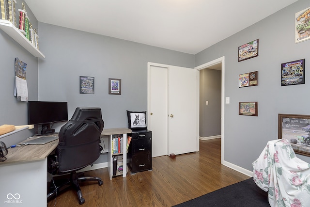 office with dark hardwood / wood-style floors