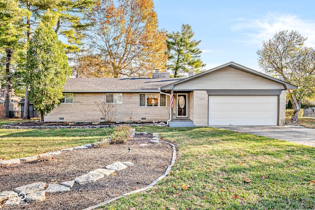 ranch-style home with a front yard and a garage