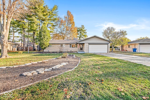 ranch-style house featuring a front lawn and a garage