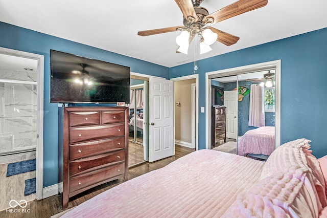 bedroom with a closet, ceiling fan, dark hardwood / wood-style flooring, and ensuite bathroom