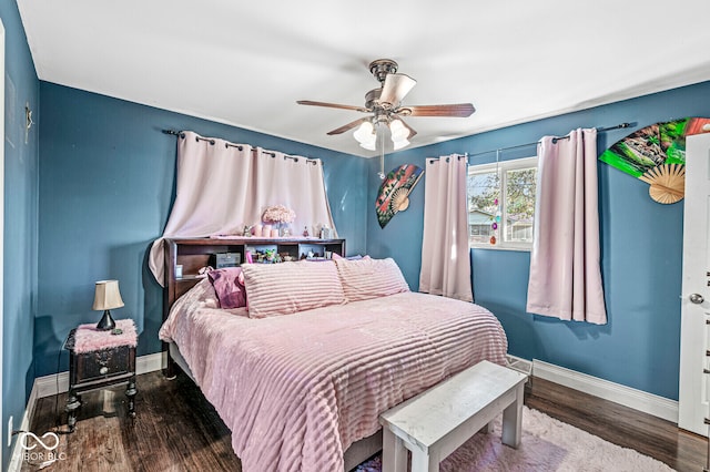 bedroom with ceiling fan and wood-type flooring