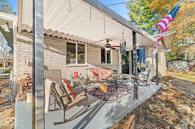 view of patio featuring an outdoor living space and ceiling fan