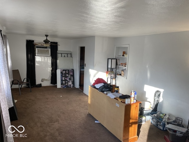 living room with ceiling fan, dark carpet, a textured ceiling, and a wall mounted AC