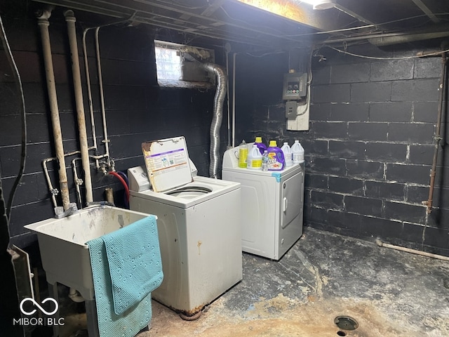 laundry room with washer and dryer and sink