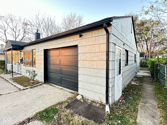 view of property exterior with a garage