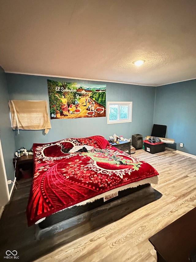 bedroom featuring hardwood / wood-style flooring