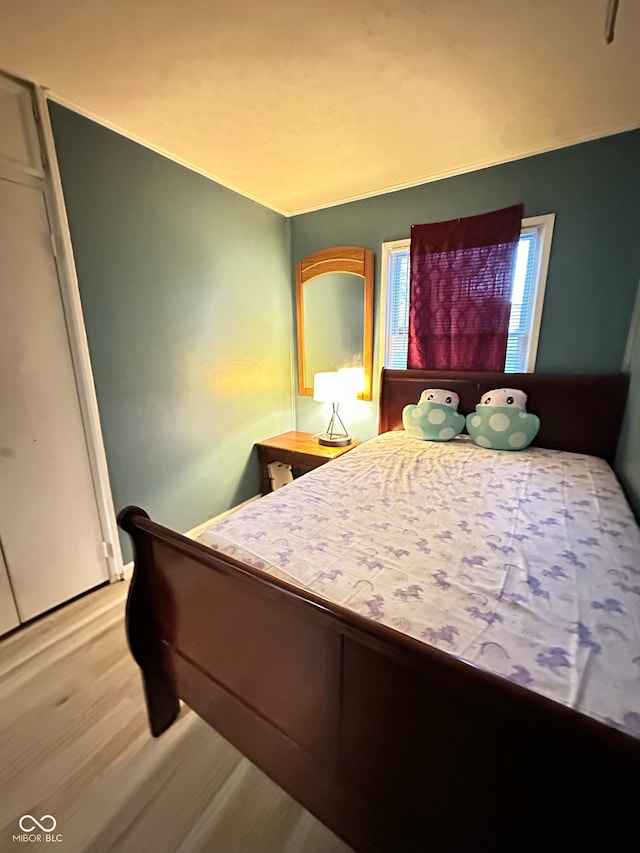 bedroom with light wood-type flooring