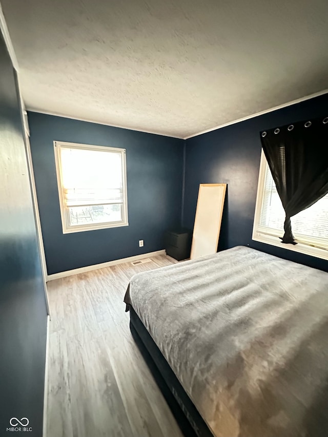 bedroom featuring light wood-type flooring