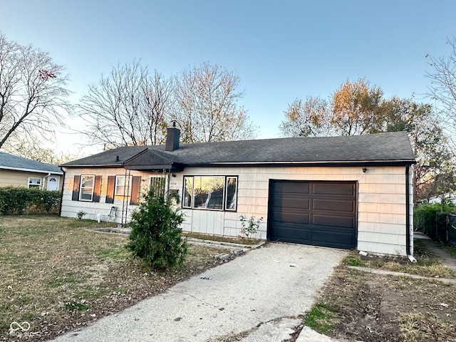 ranch-style house featuring a garage