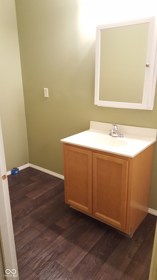 bathroom with vanity and hardwood / wood-style flooring