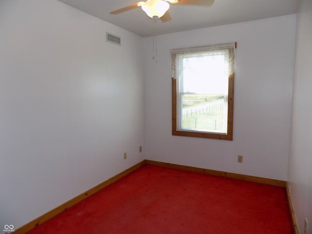 empty room with carpet flooring and ceiling fan