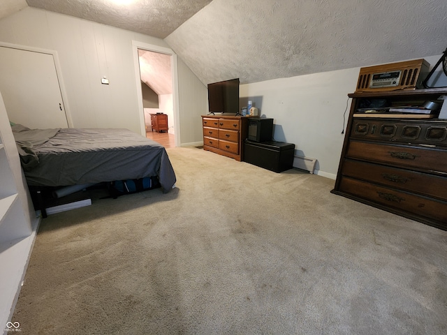 carpeted bedroom with a baseboard radiator, lofted ceiling, and a textured ceiling