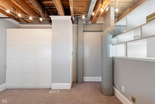 basement with light colored carpet