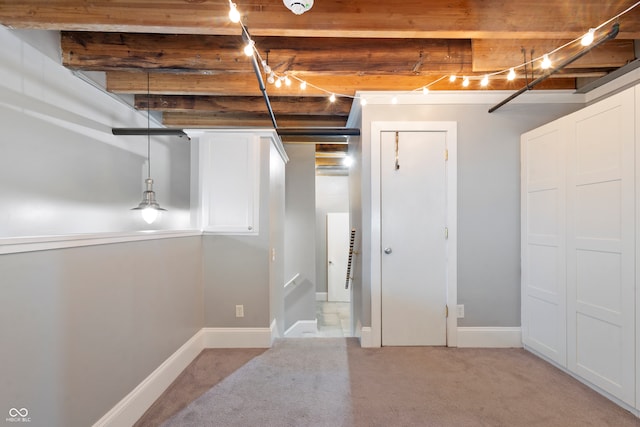 basement featuring light colored carpet