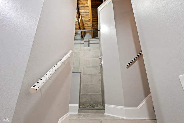 staircase featuring tile patterned floors