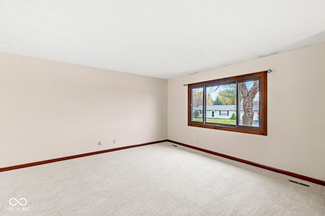 spare room with carpet floors