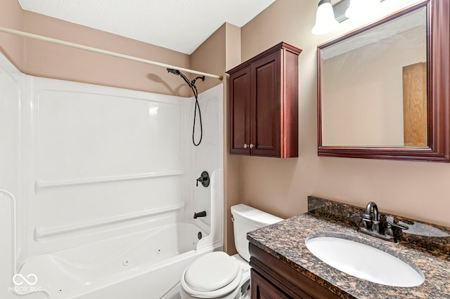 full bathroom featuring shower / bathing tub combination, vanity, toilet, and a textured ceiling