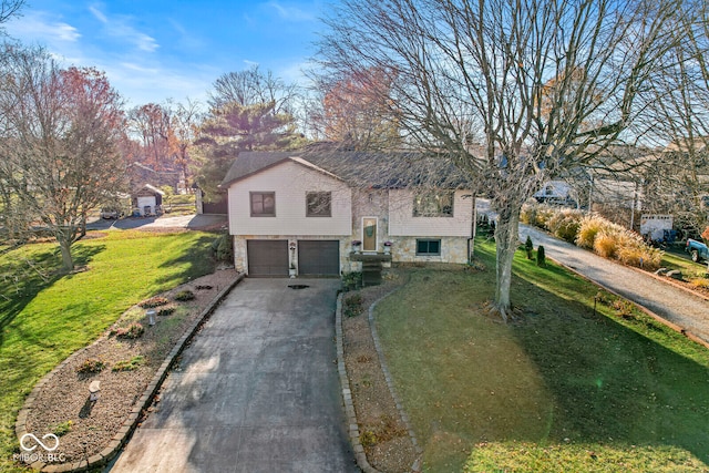 bi-level home featuring a front yard and a garage