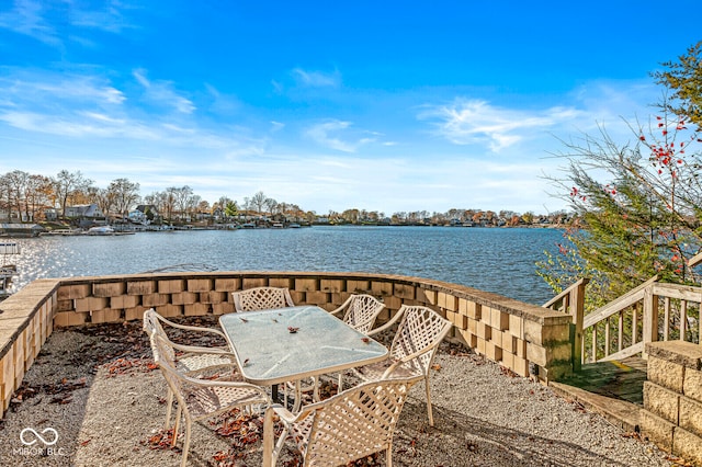 view of patio with a water view