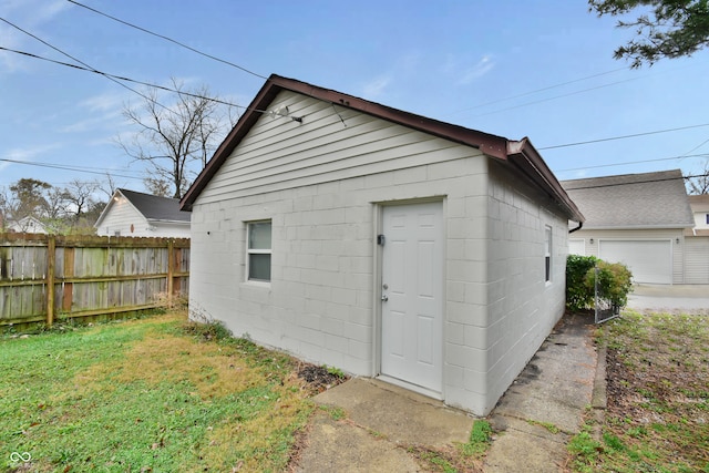 view of outbuilding with a lawn