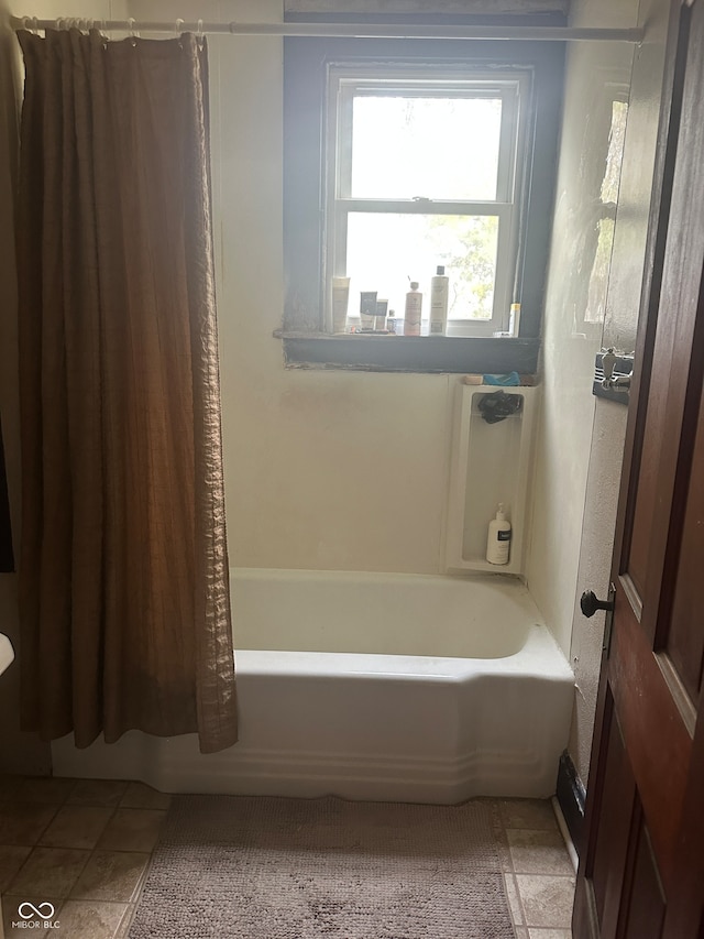 bathroom with shower / bathtub combination with curtain