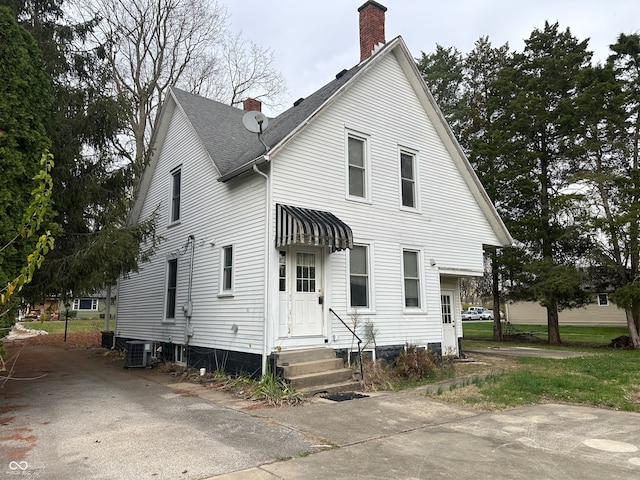 view of front of property featuring central air condition unit